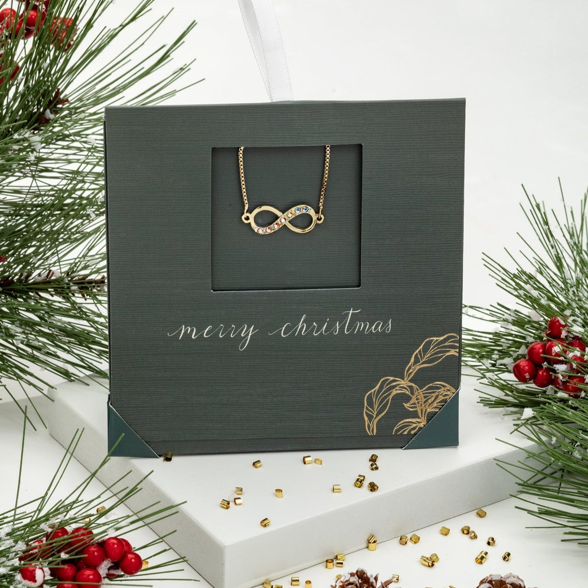 Infinity bracelet with Swarovski crystals, adjustable design, available in gold or rhodium finish – by callura