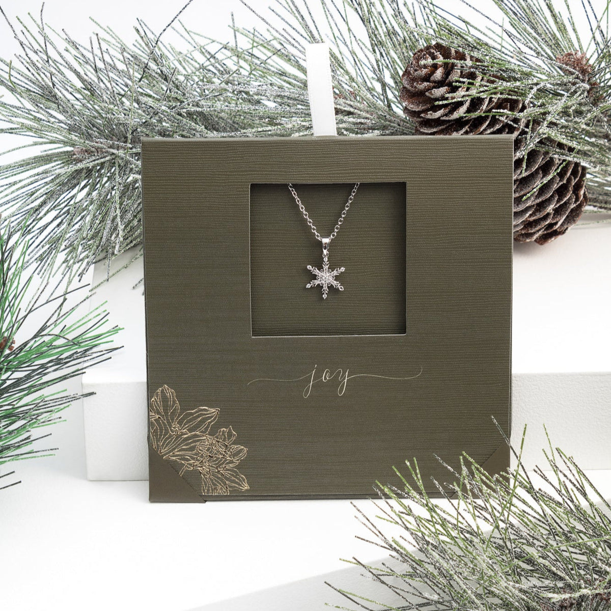 Classic snowflake necklace with rhodium plated stainless steel, winter-inspired design, gift-ready by callura