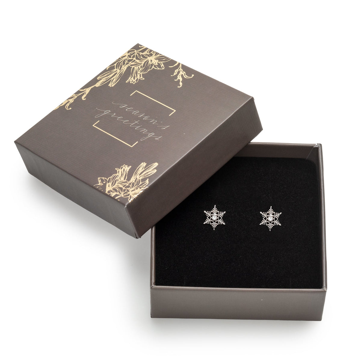 callura star-like snowflake stud earrings displayed in a decorative gift box