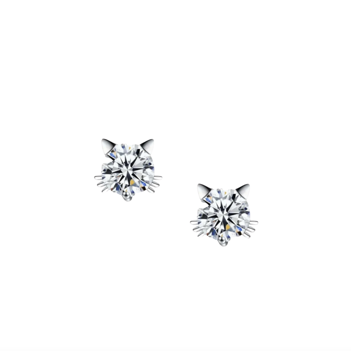 Close-up of callura stud earrings with a central stone and surrounding decorative details