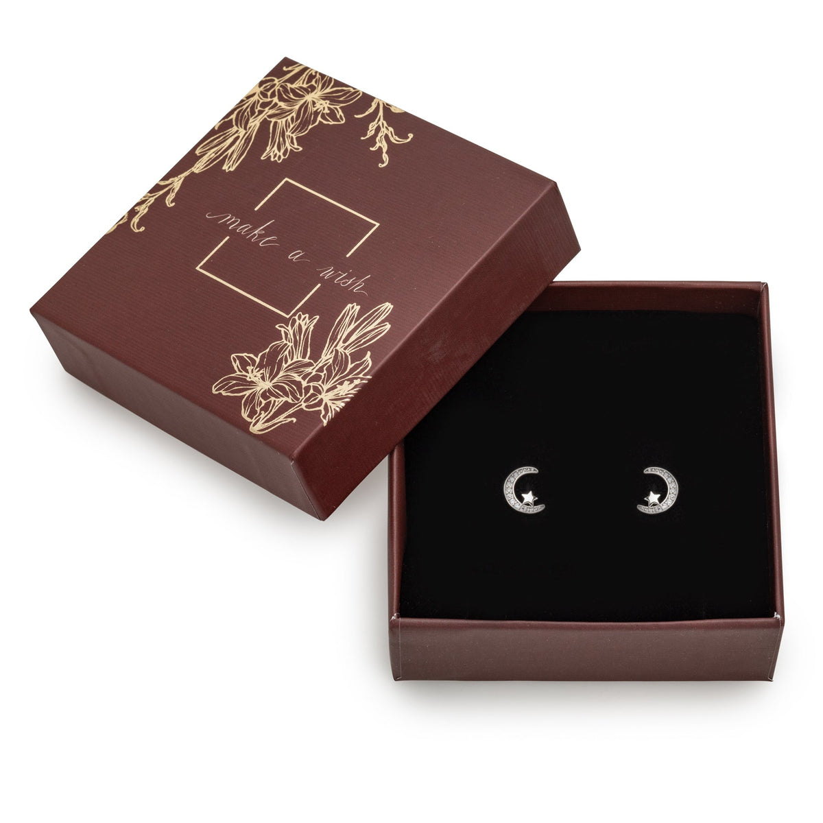 callura crescent moon earrings with star details displayed in a decorative gift box